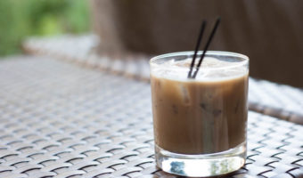 A Cold Bew XO cocktail sitting on a rattan table